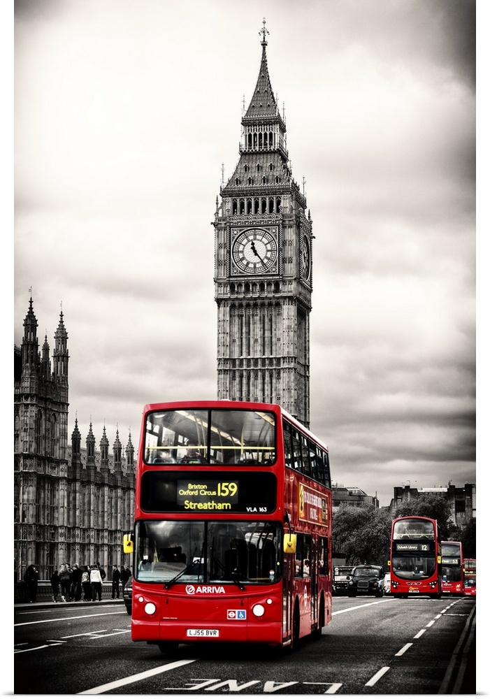 Photograph with selective color of the iconic double decker bus driving past Big Ben in London.