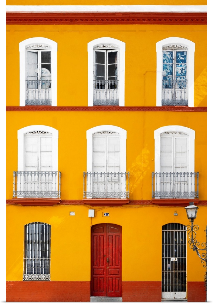 It's a beautiful orange facade of an old building in Seville, Spain.