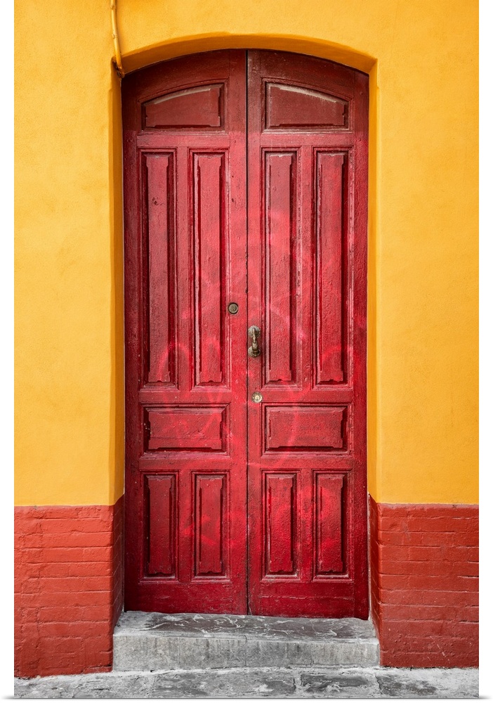 It's an old red door in a street of Seville in Spain.