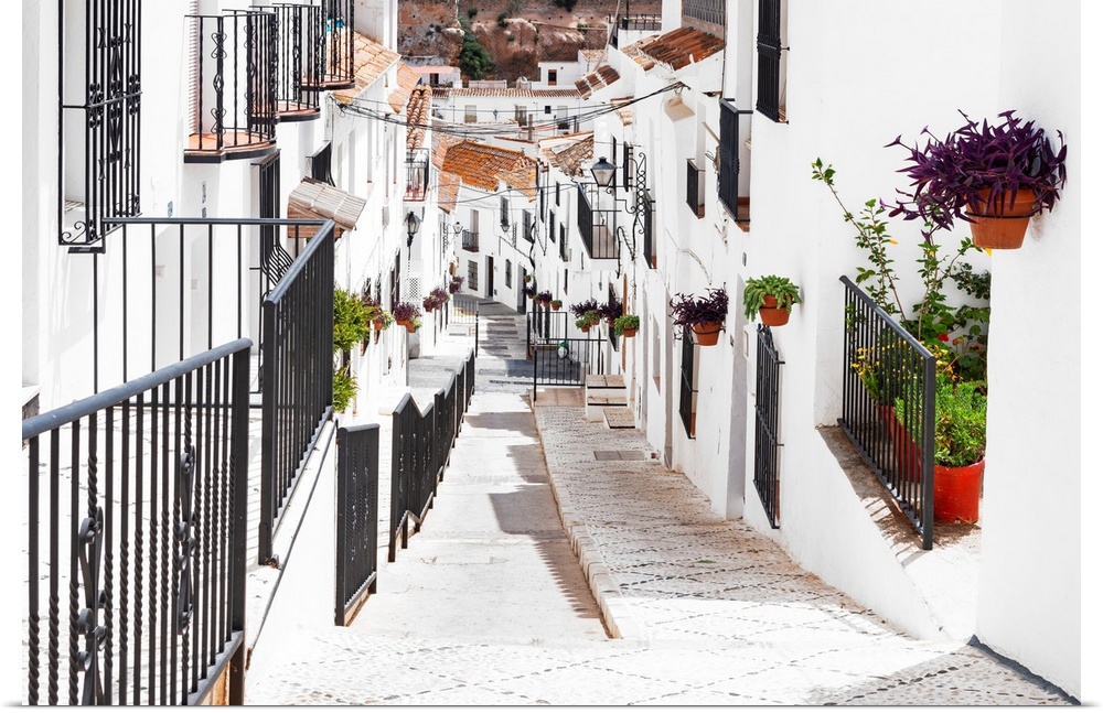 It's a street with white facades in the city of Mijas (Malaga) in Andalusia, Spain.