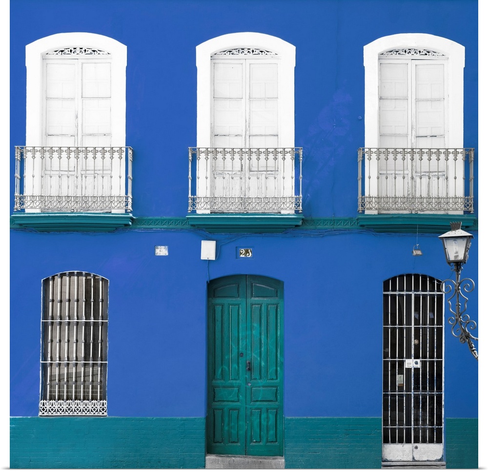 It's a beautiful blue facade of an old building in Seville, Spain.