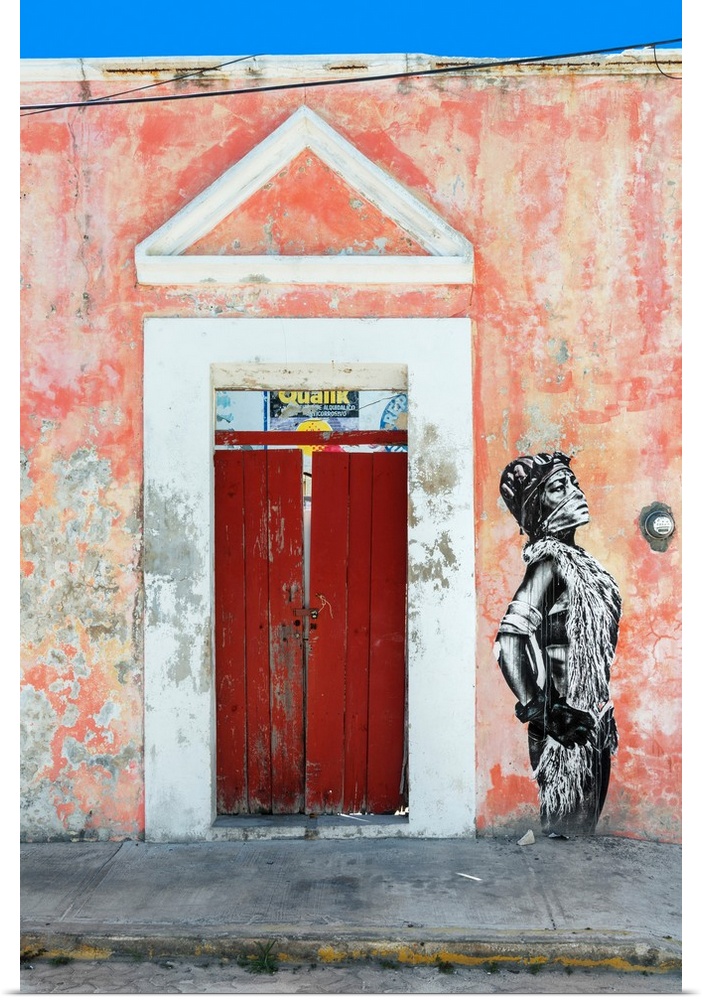 Photograph of the exterior of a building with a red door and graffiti of a woman spray painted on the wall. From the Viva ...