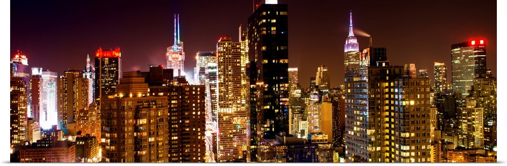 A photograph of New York city at night, with neon light shining bright.