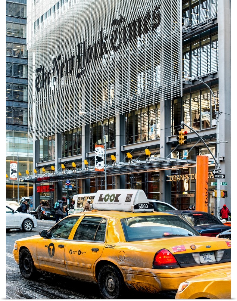 A photograph of NYC taxi's in front of the New York Times building.