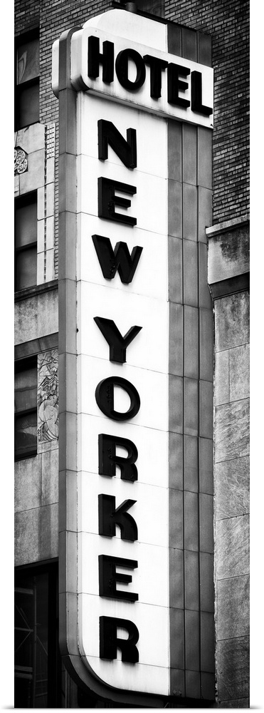 Black and white photo of the vertical sign for the New Yorker hotel.