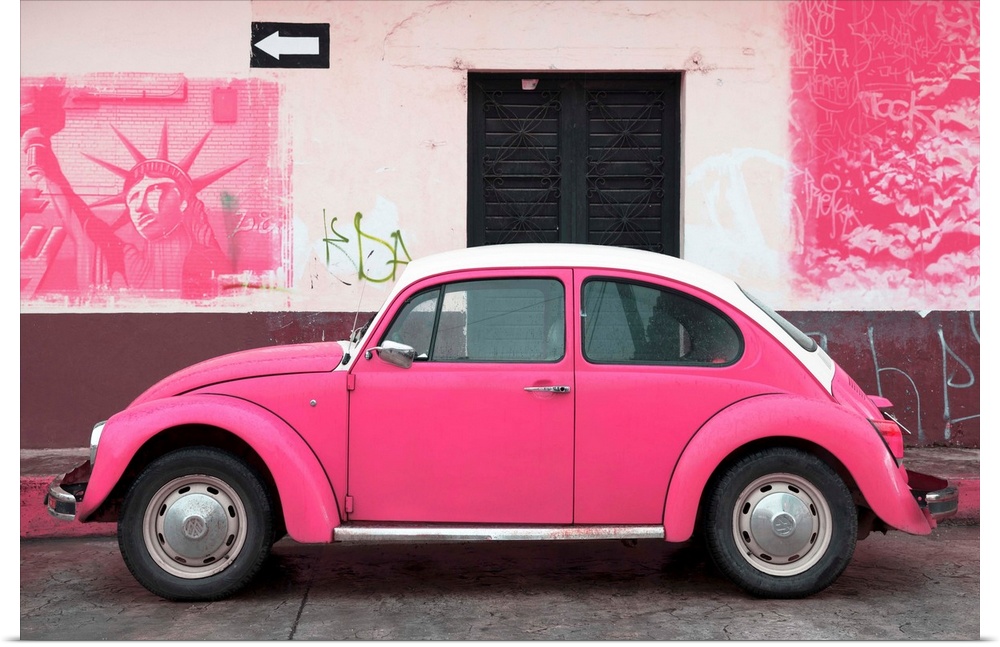 Photograph of a pink Volkswagen Beetle parked in front of a wall covered in pink American graffiti, Mexico. From the Viva ...