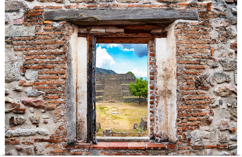 View of the Pyramid of Cantona, Mexico, framed through a stony, brick window. From the Viva Mexico Window View.