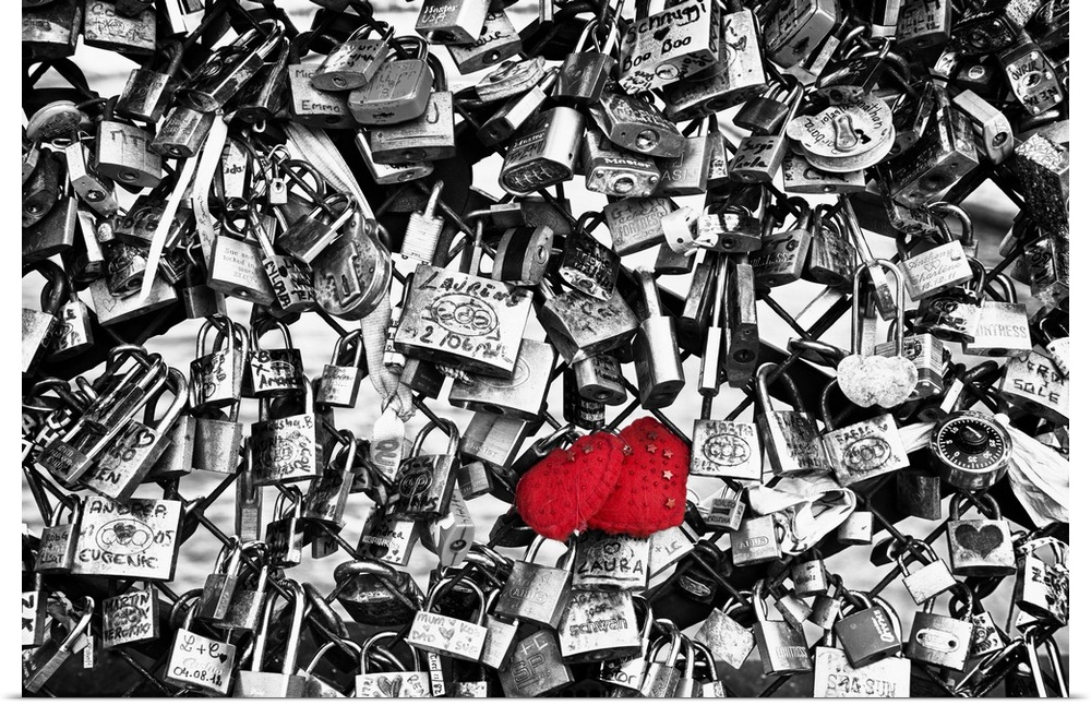 Collection of locks left by couples on the Pont des Arts in Paris, France, with selective coloring.