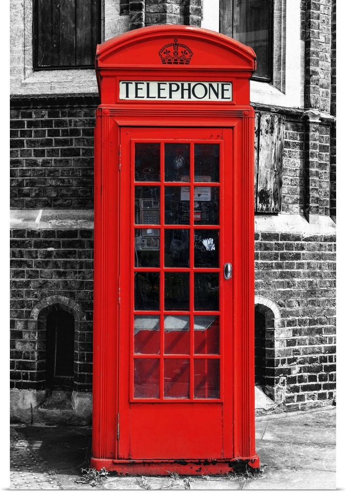 Fine art photo of an iconic red telephone booth on a London street corner.