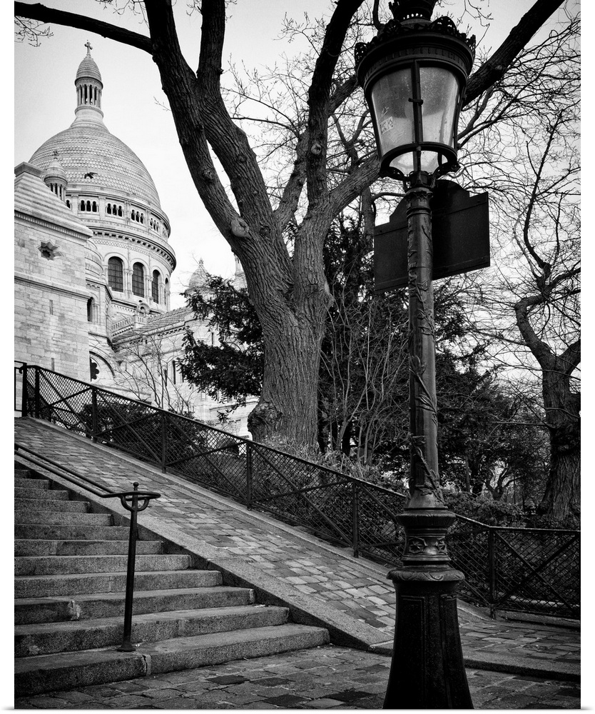 A lamppost and stairway leading up to Sacre Coeur in France.