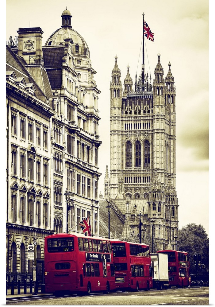 Row of double decker buses on the street by the House of Parliament in London, England.