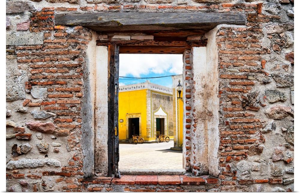View of Izamal (The Yellow City), Mexico, framed through a stony, brick window. From the Viva Mexico Window View.