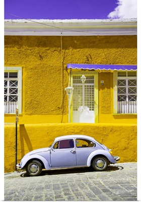 VW Beetle Car and Yellow Wall