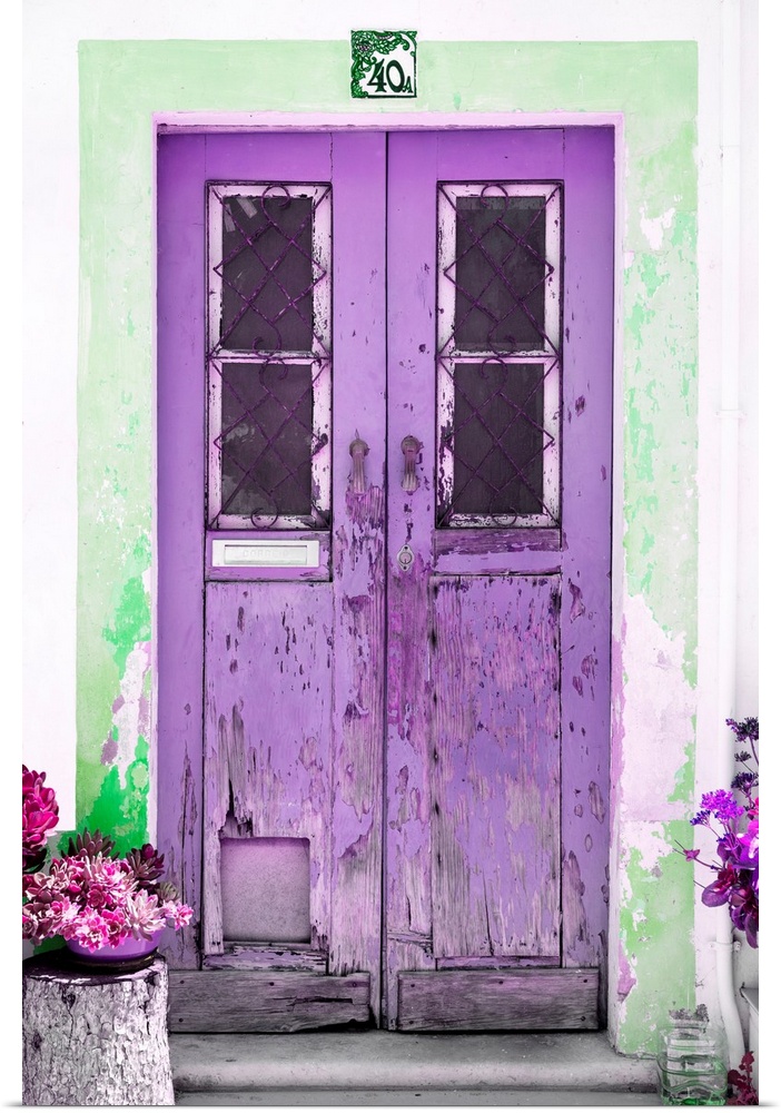 It's an old purple door entrance to a traditional house in Portugal.