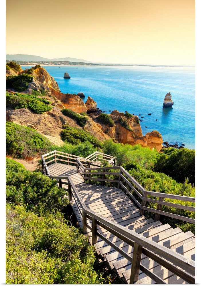 It's the wooden staircase at sunset that goes down to the Praia do Camillo in Lagos (Portugal).