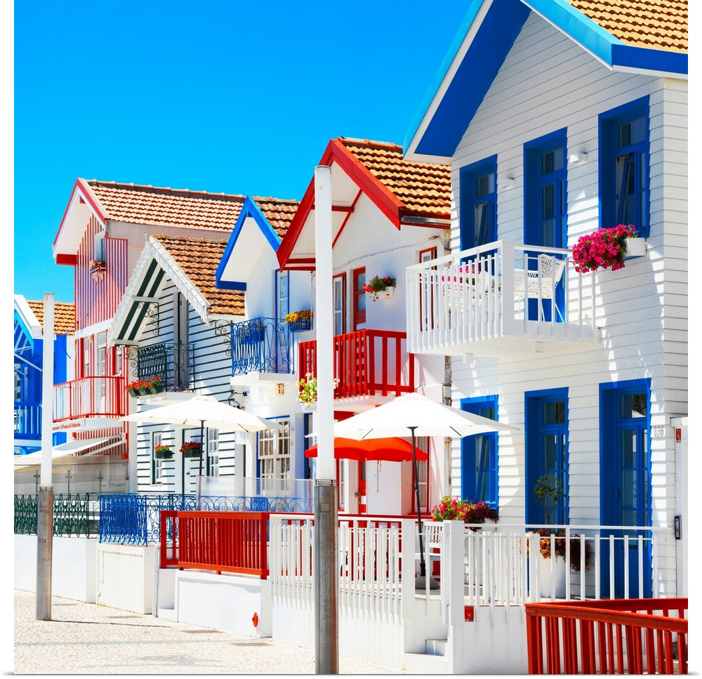 These are colorful white houses with stripes in Costa Nova Beach, Portugal.