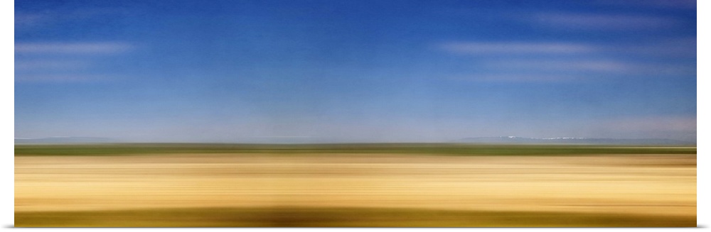 Photograph of golden western plains looking as if they're rushing by.