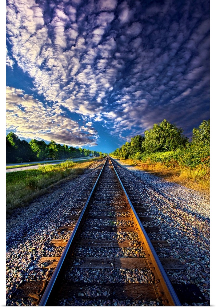Dramatic cloudscape over railroad tracks in the countryside of Wisconsin.