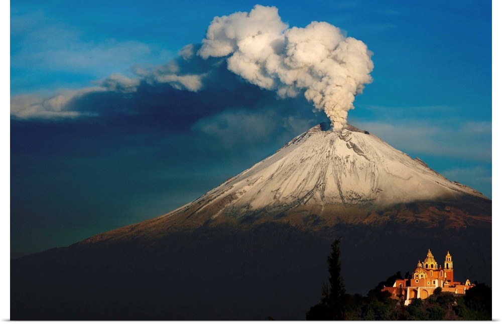 Clouds of ash rising from snowy  Popocatepetl volcano, Mexico.