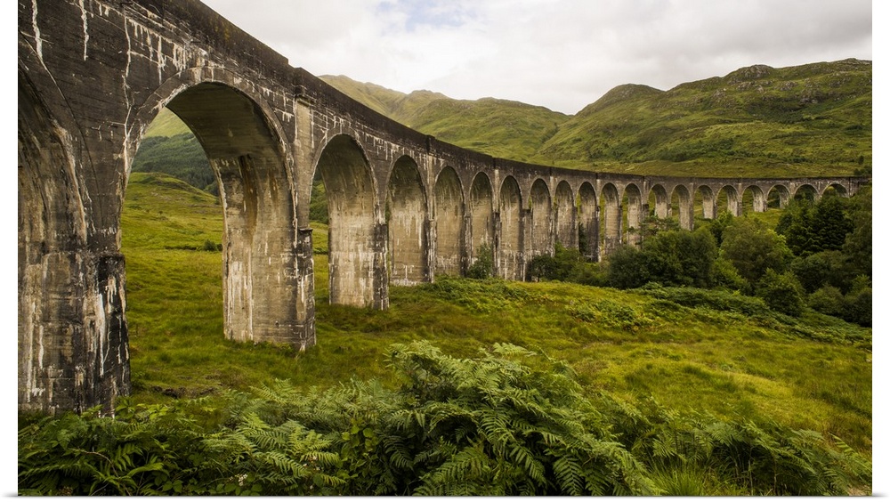 Stone viaduct with an impressive arch system in the countryside of Scotland.