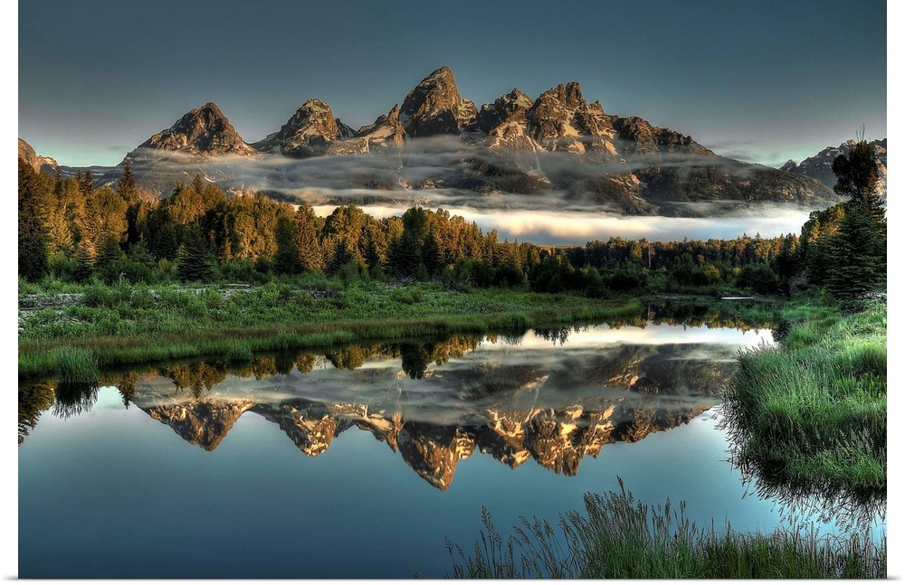 A unique morning at Schwabacher's landing, with two rows of clouds under the mountain peaks.