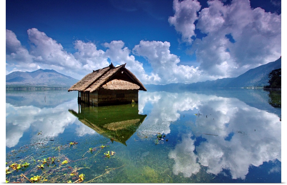 A houseboat on a clear blue lake, Batur Lake, Kintamani, Bangli, Bali, Indonesia.