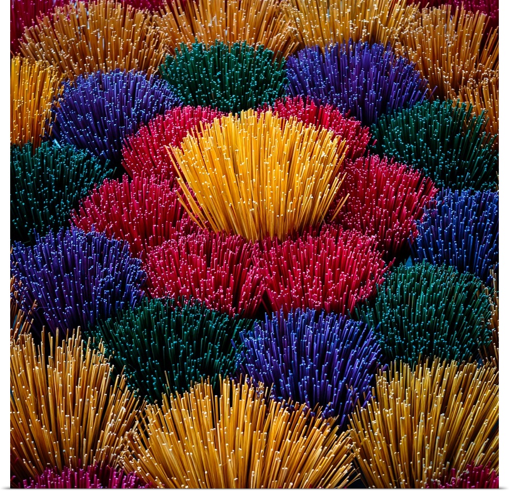 Colourful incense sticks for sale at a market in Vietnam.