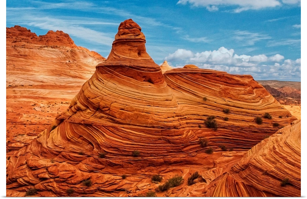 A tall rock formation in the desert in Vermilion Cliffs, Arizona.
