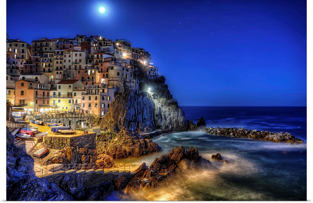 Buildings at the edge of the sea, Cinque Terre, Italy, at night.