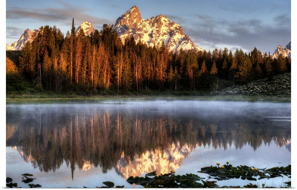 An image of the Grand Tetons at sunrise.
