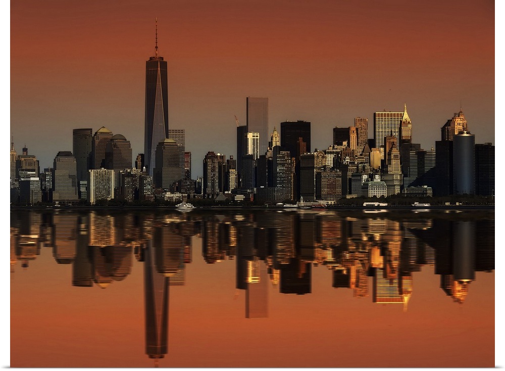 The New York City skyline perfectly mirrored in the bay below.