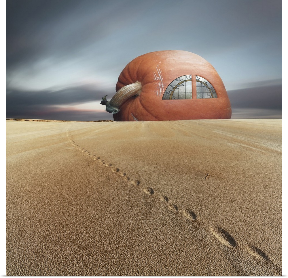 Conceptual photo of a house made of a giant pumpkin in the sand.