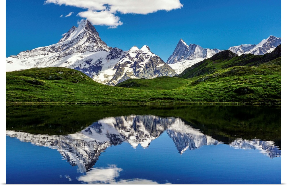 Mountains of the Swiss Alps reflected in the lake Bachalpsee.