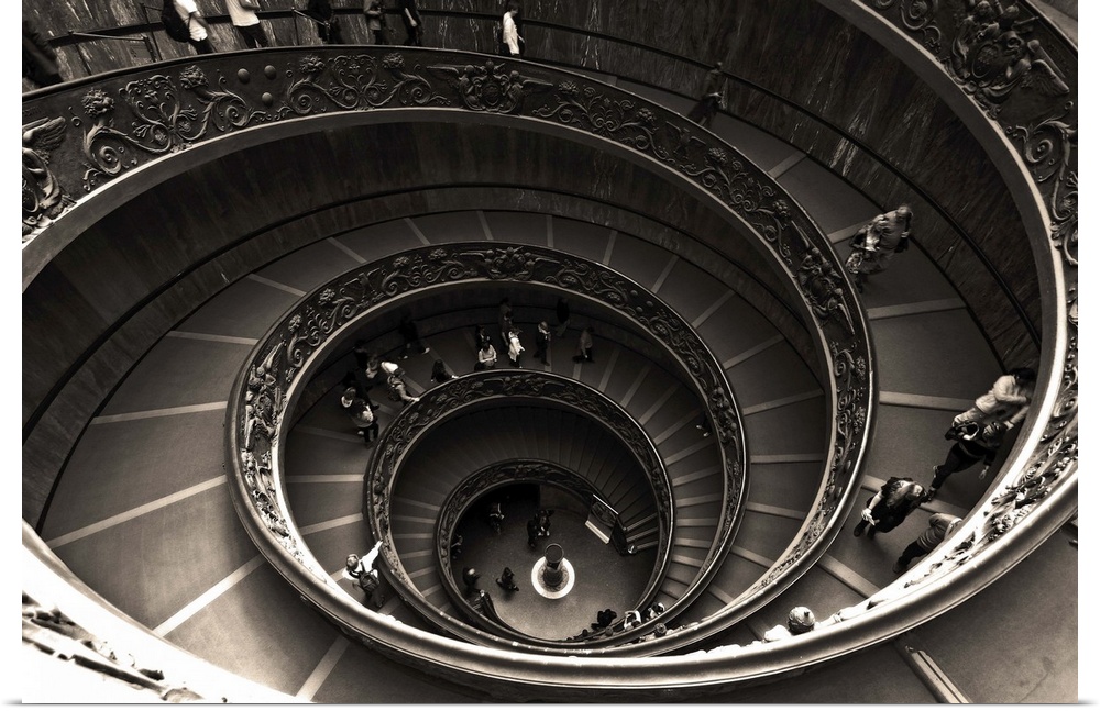 Photograph of a spiral staircase with elaborate railings.