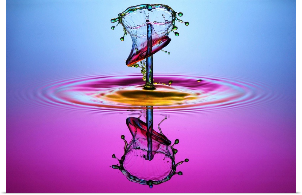 A droplet forming an abstract shape as it splashes into the water.