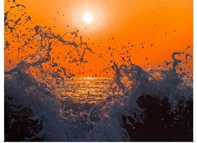 Sunset and Splashing Wave