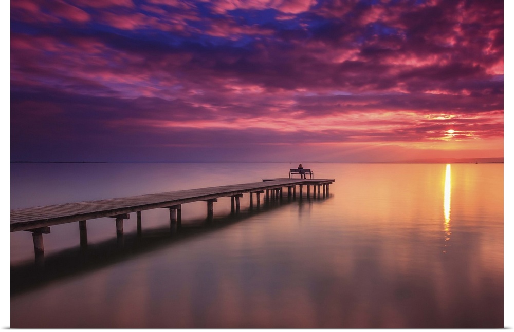 A pier in Lake Neusiedl at sunset, Austria.