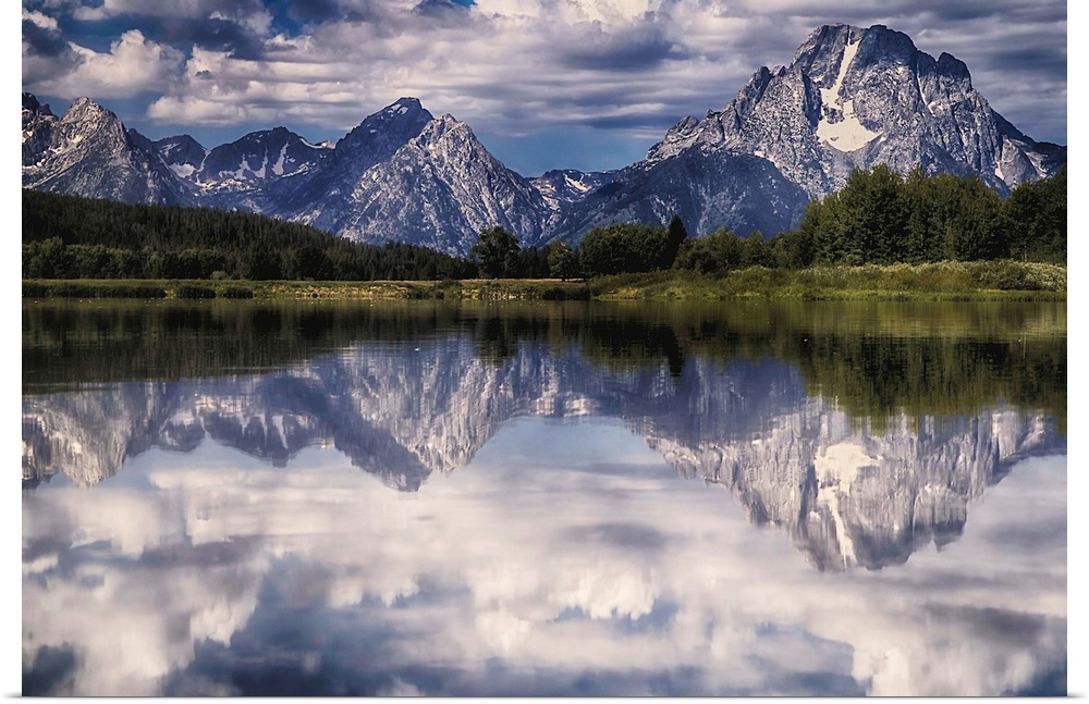 A mirror image of the Tetons reflecting on the Snake River at Oxbow Bend.