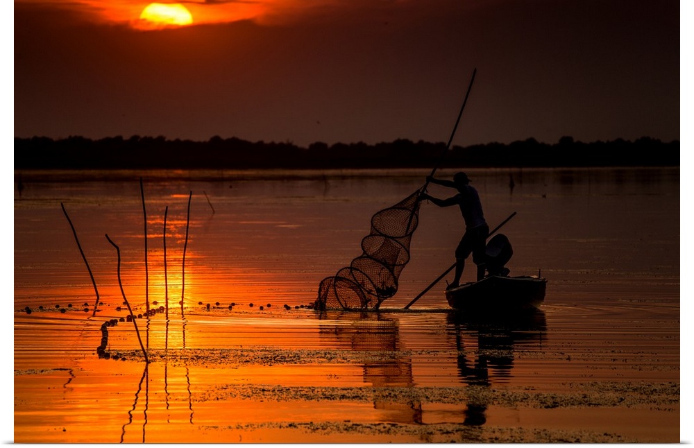 A fisherman from Danube Delta, Romania at sunset.