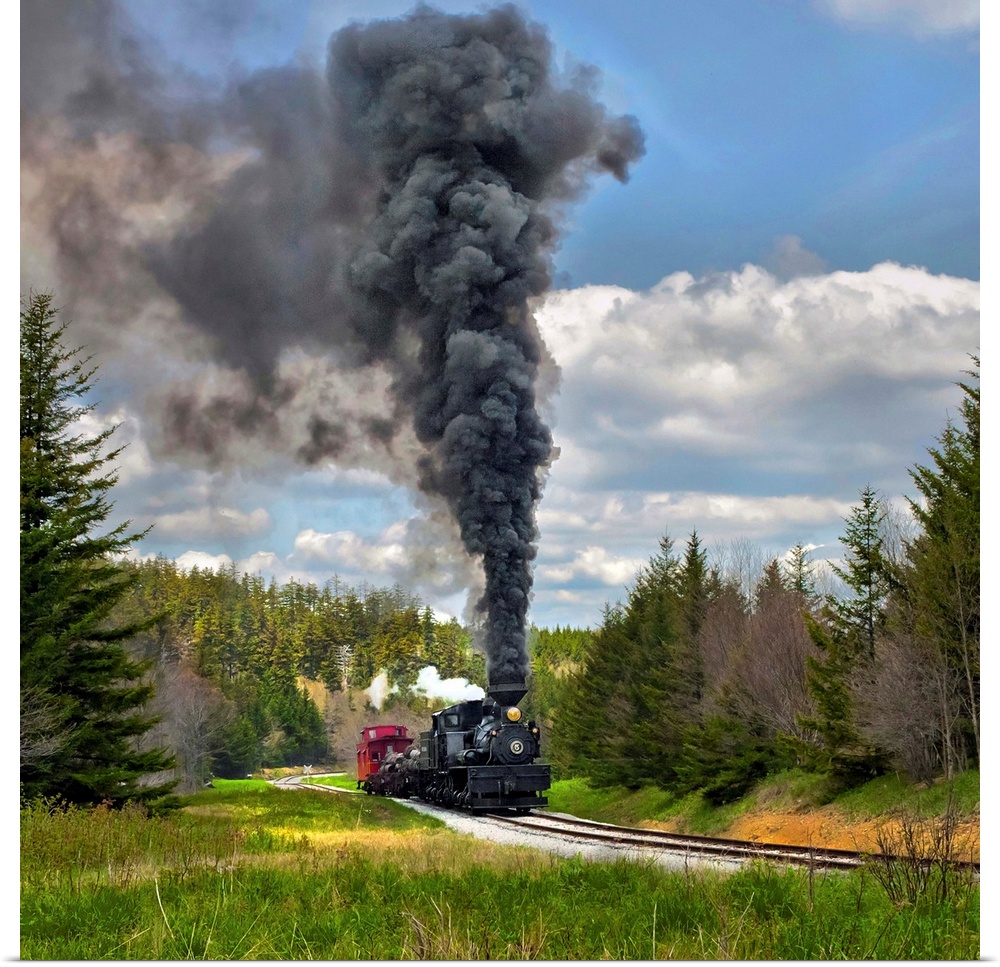 Locomotive with dark smoke billowing from its smokestack.