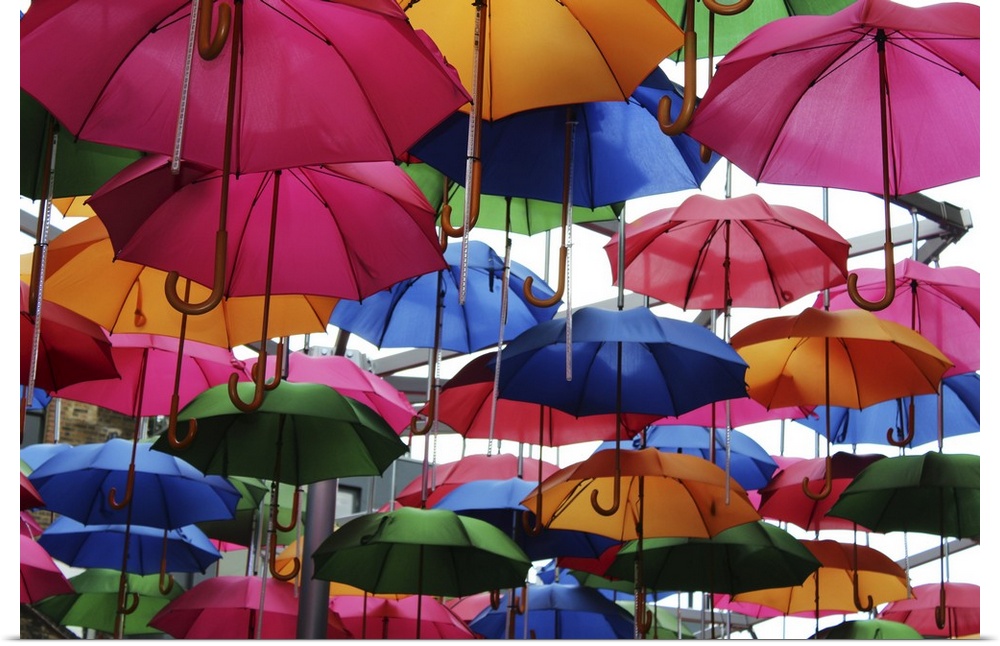 Colorful umbrellas over Vinopolis Piazza, Borough Market, London, England.