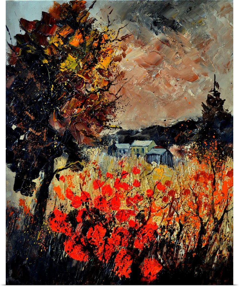 An autumn scene of red blooming flowers in a field near a small village.