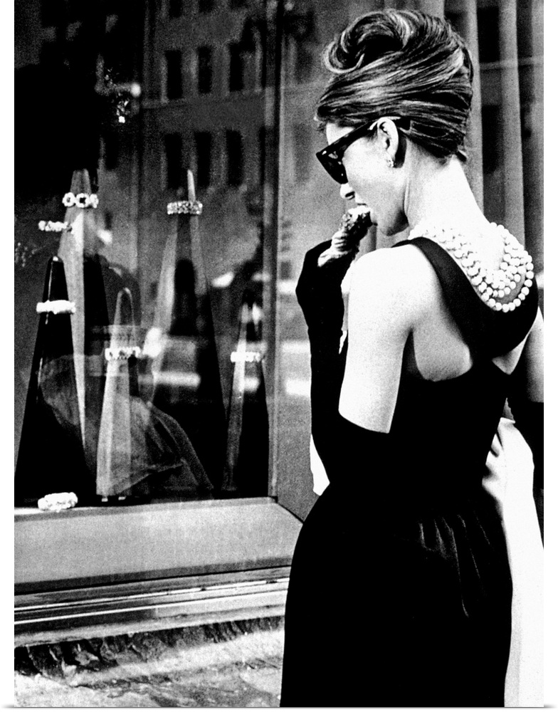 Big photograph showcases a famous Hollywood actress as she stares through an outdoor display case of jewelry.  This Britis...