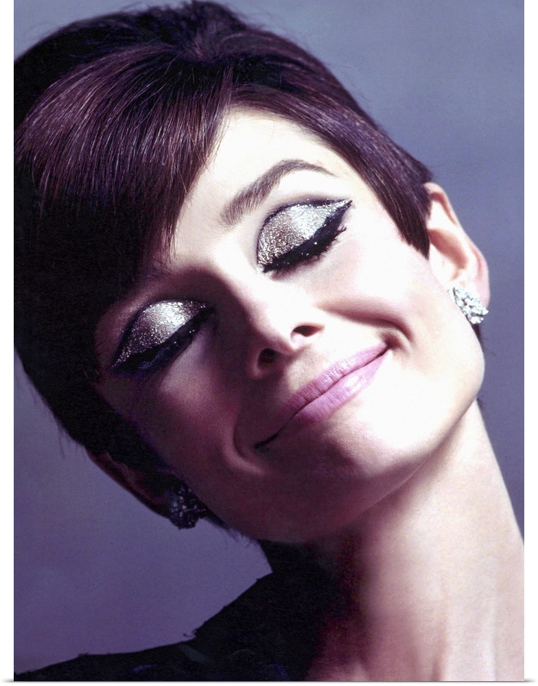 Canvas photo art of Audrey Hepburn with sparkling eye make up smiling.