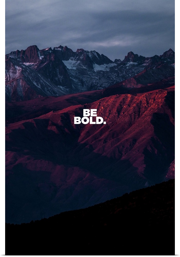 Motivational sentiment over a dramatic sunset mountain view.
