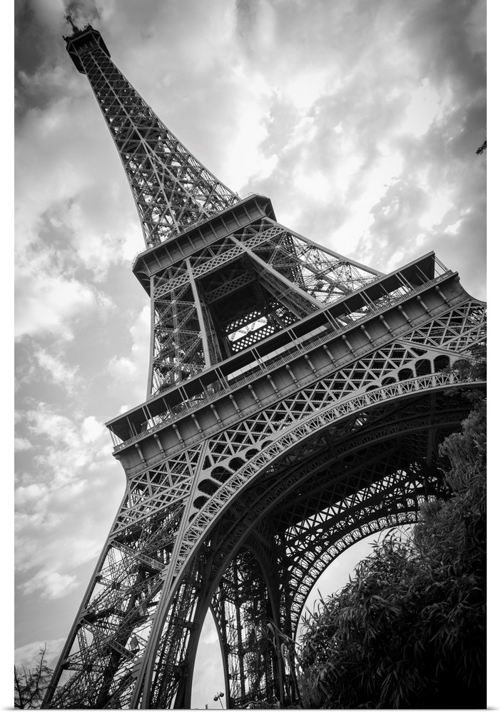 Black and white photograph of he Eiffel Tower from a unique angle.