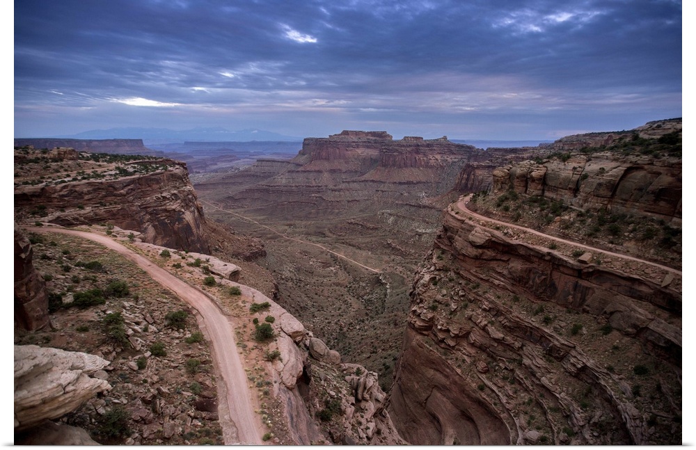 Landscape photograph of a view at Canyonlands National Park with a dark blue sky.