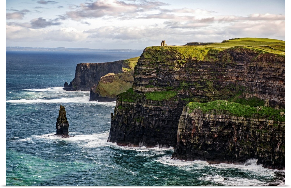 Photograph of the Cliffs of Moher with O'Brien's Tower seen in the distance, marking the highest point of the Cliffs of Mo...