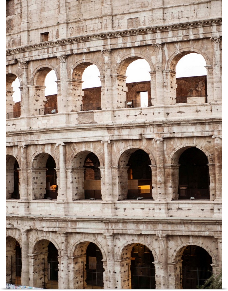 Detailed photograph of the Colosseum walls in Rome.
