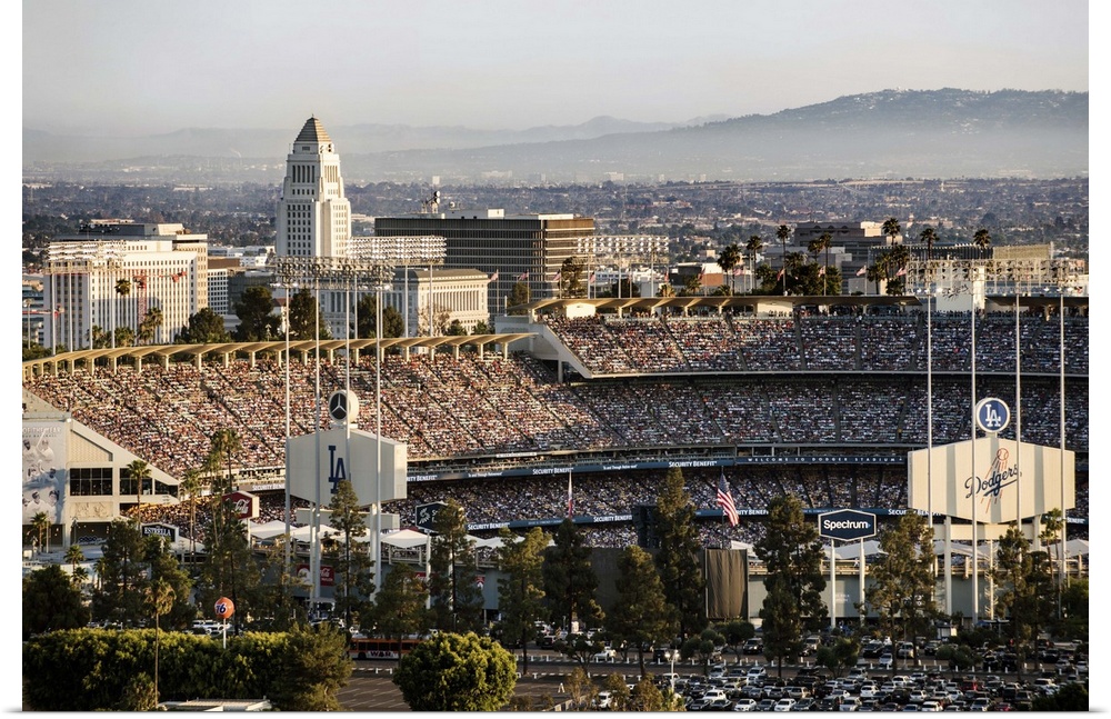 Photograph of Dodgers Stadium on game day with a view of the Los Angeles rolling hills in the background.
